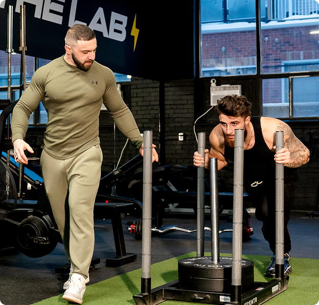 personal trainer helping client build muscle in Downtown Toronto